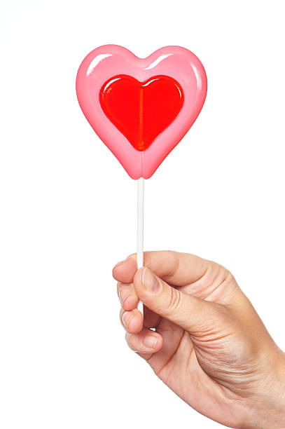 istock Hand holding lollipop heart 534863267