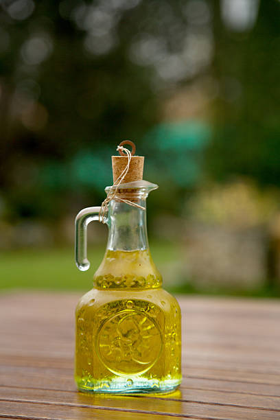 istock Olive oil and olive branch on the wooden table 534864207