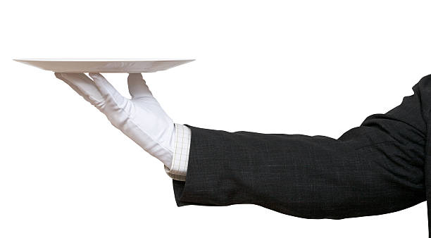 istock side view of hand in white glove with white plate 534868115
