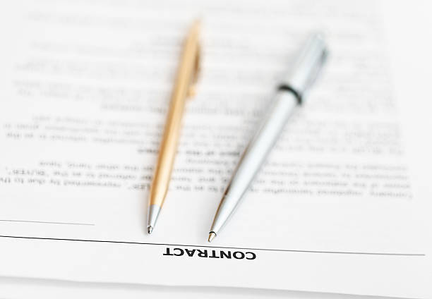 istock sales contract and two pens close up 534868843