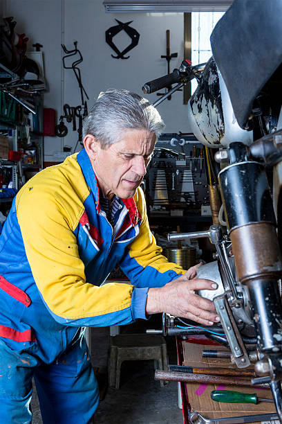 istock mechanic repairing a motorbike engine 534869145