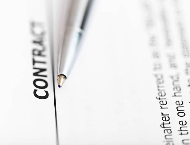 istock agreement and tip of silver pen 534869157