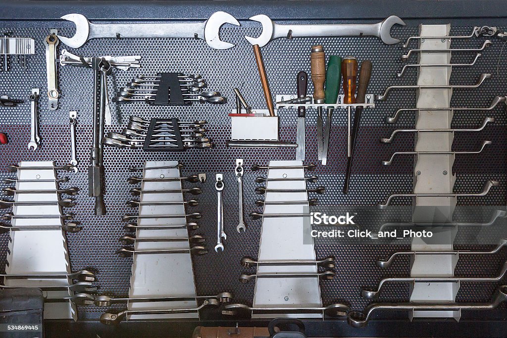 tool board mechanic tools hanging on a organized board on a vehicle reparation workshop 2015 Stock Photo