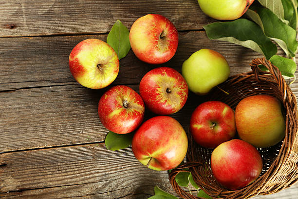 istock Beautiful apples on brown wooden background 534869913