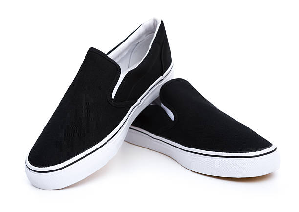 istock pair of black sneakers on white 534869943