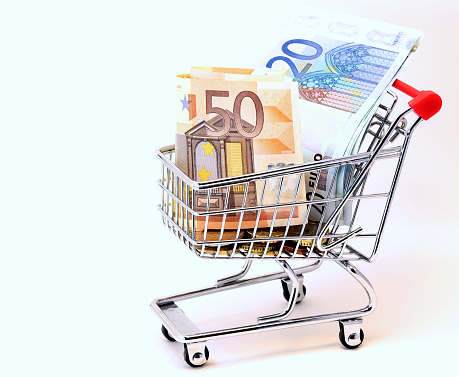 european shopping cart full of euro banknotes