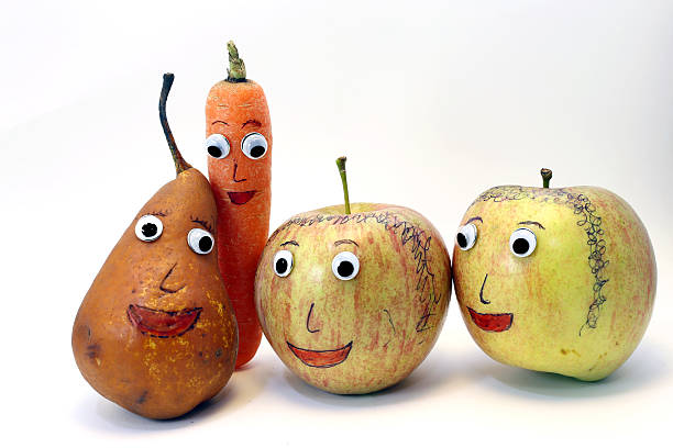 istock PEAR and carrot and two apples with big eyes 534870197