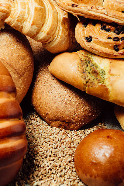 istock Assortment of baked bread on wood table 534878140