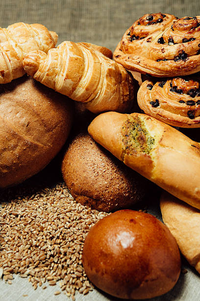 istock Assortment of baked bread on wood table 534879324