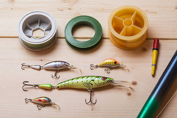 istock Fishing tackle on a wooden table 534879338