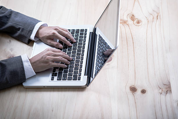 istock Closeup of businessman hands typing on laptop computer 534879630