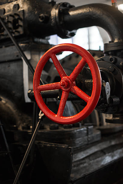 istock Red valve. Part of old power plant. 534888403