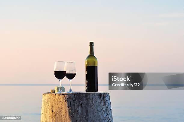 Red Wine Bottle And Wine Glasses Stock Photo - Download Image Now - Beach, Wine, Wine Bottle