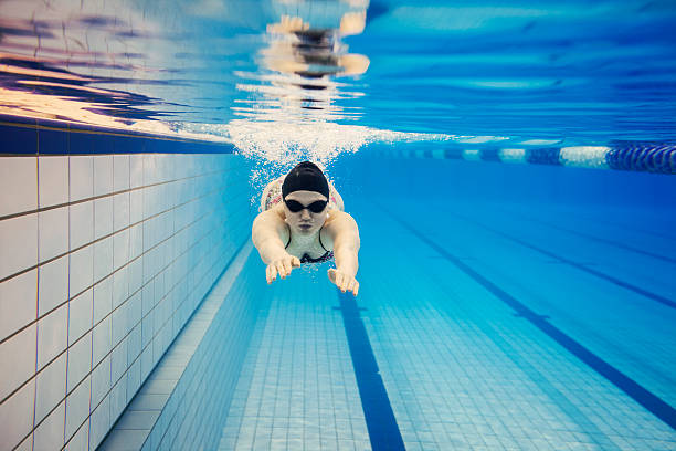 istock Young Woman Swimming Underwater 534888773