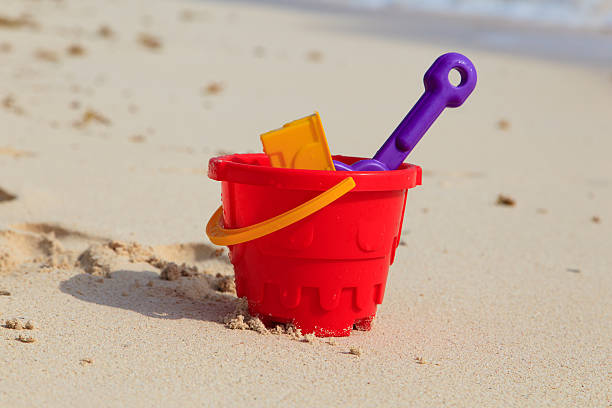 istock kids toys on sand beach 534890125