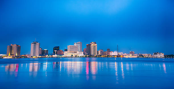 New Orleans Night Panorama Skyline New Orleans Skyline. Panoramic composition. image created 21st century blue architecture wide angle lens stock pictures, royalty-free photos & images