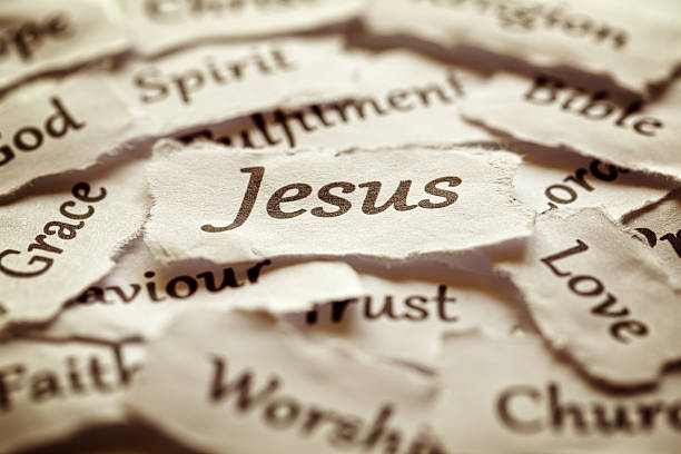 Jesus Torn paper words of religion with focus on word Jesus god and jesus stock pictures, royalty-free photos & images