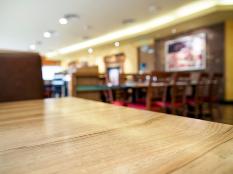 Wooden Table top with Blurred Restaurant Background