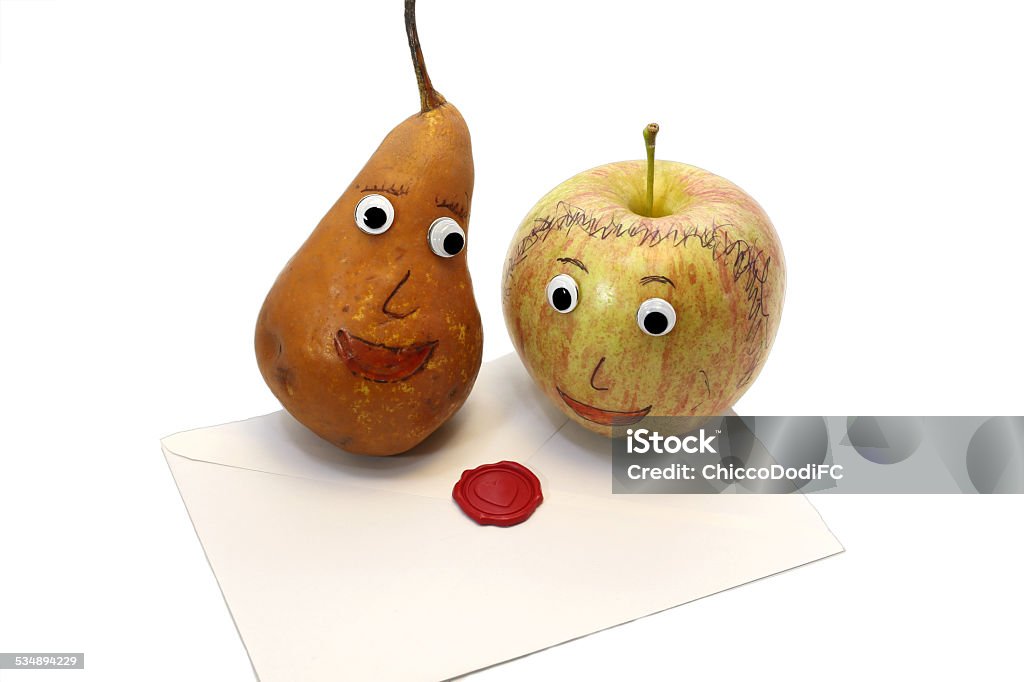 pair of fruits Apple and pear and the letter funny pair of fruits Apple and pear with eyes and the letter with the seal of love 2015 Stock Photo