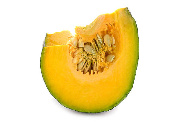 istock piece of fresh pumpkin with seeds on white background 534894295