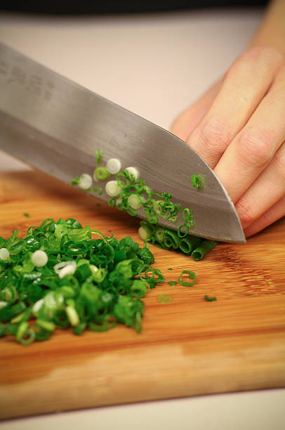 Chopping Green Onions stock photo