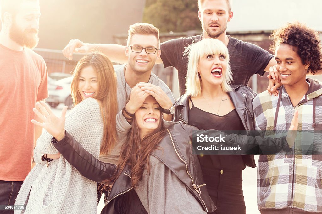 Happy Friends, outdoor portrait Outdoor portrait of multi ethnic group of happy young people, having fun and laughing at the camera. 2015 Stock Photo
