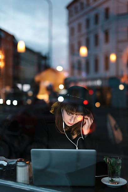 istock Woman in Cafe Working on Laptop 534895065