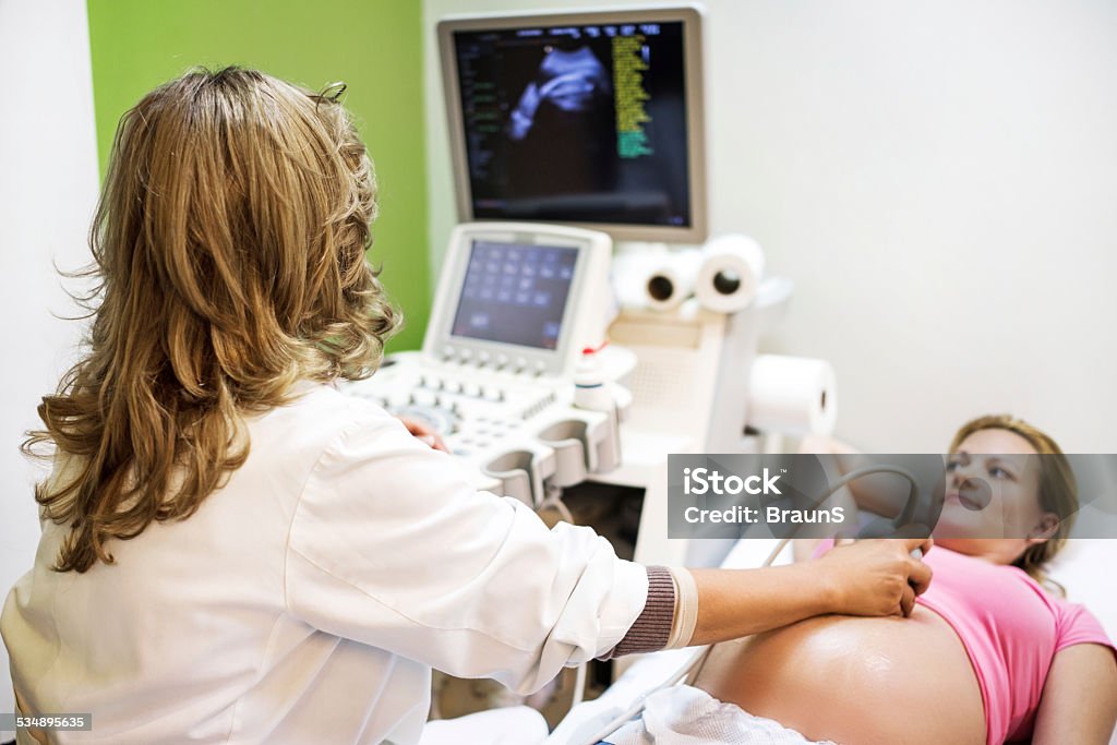 Gynecological examination. Young pregnant woman at ultrasound. 2015 Stock Photo