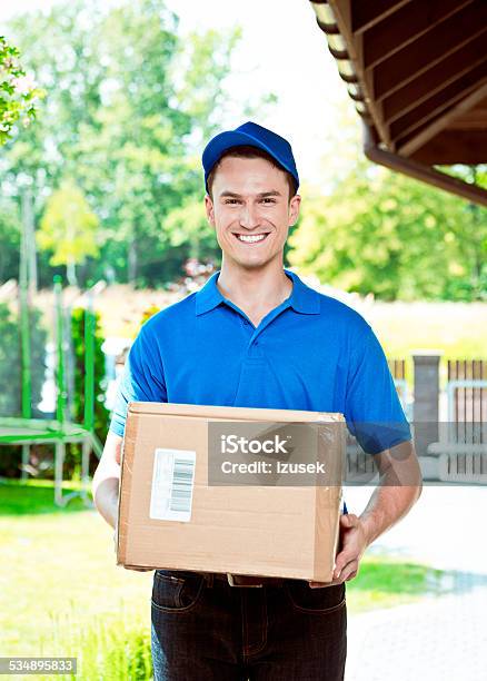 Courier Delivering Package Stock Photo - Download Image Now - Package, Postal Worker, 2015