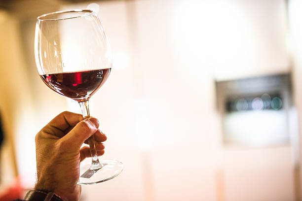 istock checking the quality or toasting gesture with wine glass 534896191