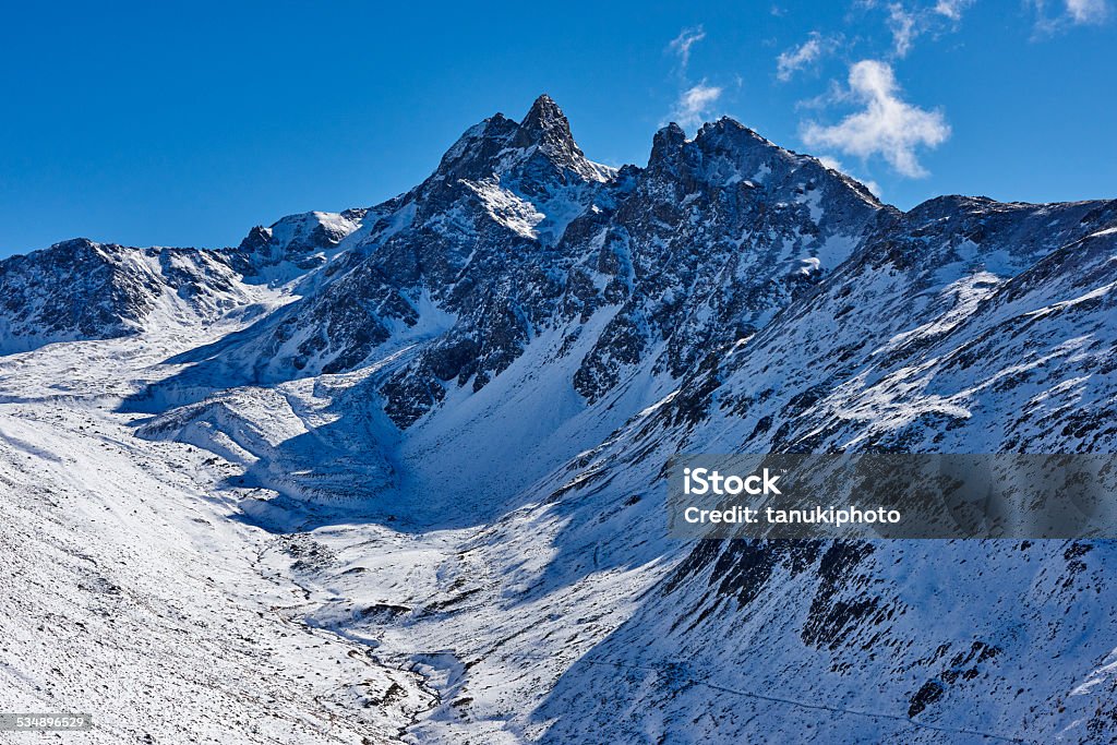 Alp Languard Peaks of Alp Languard covered with the firs snow of the season. Samedan. Majola District. Graubünden Canton. Switzerland. 2015 Stock Photo