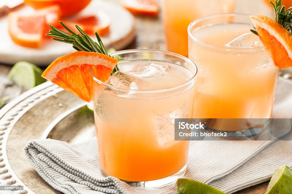 Refreshing Grapefruit and Tequila Palomas Refreshing Grapefruit and Tequila Palomas with Rosemary Cocktail Stock Photo