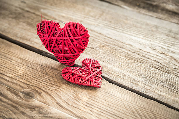 istock Handmade retro hearts on the wooden background 534917485