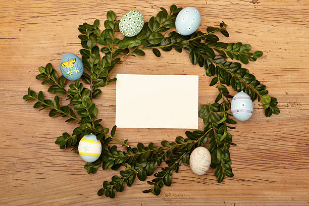istock Easter eggs and twigs, blank card on wood 534918449