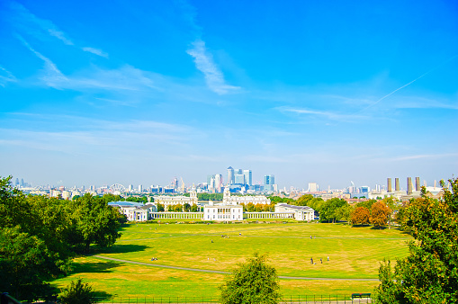 Greenwich Park, National Maritime Museum, Canary Wharf skyscrapers and London skyline on background