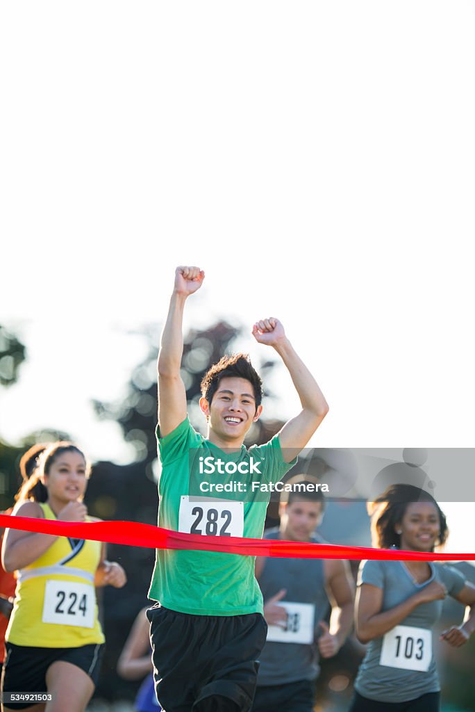 Cross Country Race Runners competing in a cross country race. 20-29 Years Stock Photo