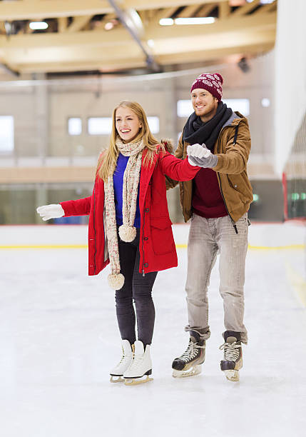 istock happy couple on skating rink 534922043