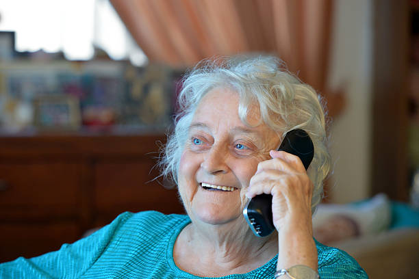 istock One old lady on the phone 534922679