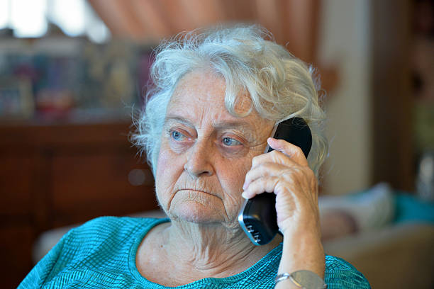 istock One old lady on the phone 534922685