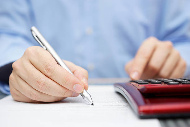 istock Businessman working with documents and calculator in office 534923073