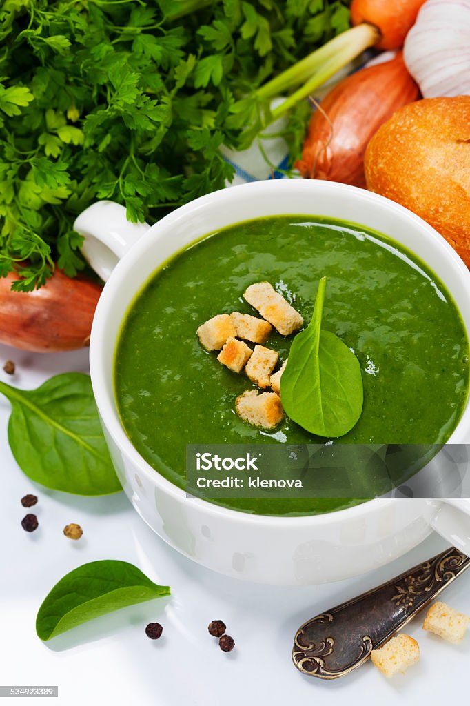 Traditional Spinach soup Traditional Spinach cream soup with croutons and fresh spinach leaf on top 2015 Stock Photo