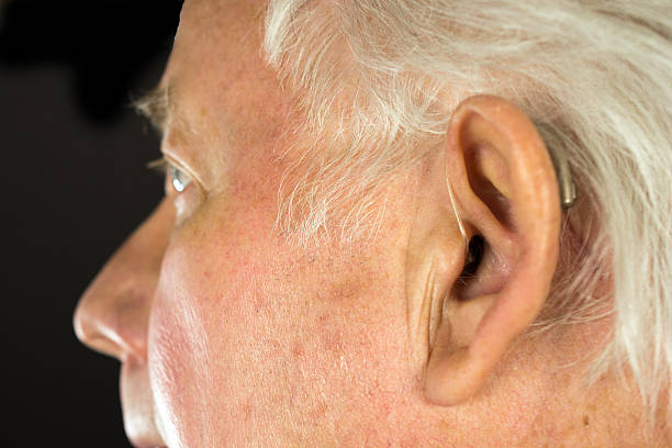 istock Senior Man's Ear with Hearing Aid 534924301