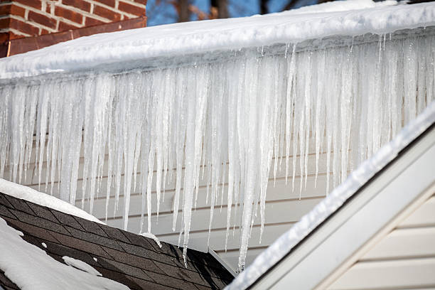 istock Multitude of Icicles Hanging From Iced Gutter on House 534924699