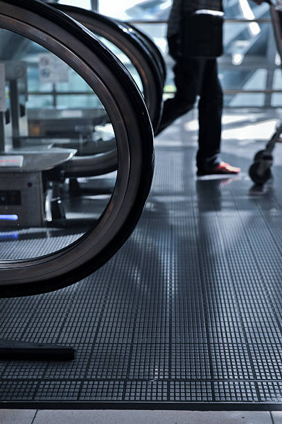 istock business people rushing on the escalator 534924829