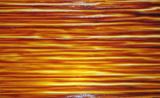 Orange and brown stained glass with horizontal lines