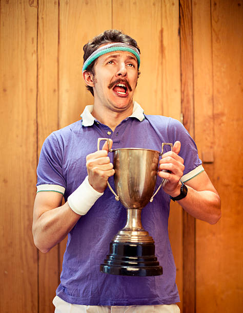 mann mit trophy - humor athlete trophy one person stock-fotos und bilder