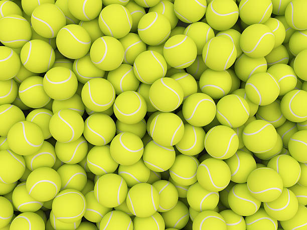 куча теннисных мячей, изолированные на белом фоне - tennis ball tennis ball white стоковые фото и изображения