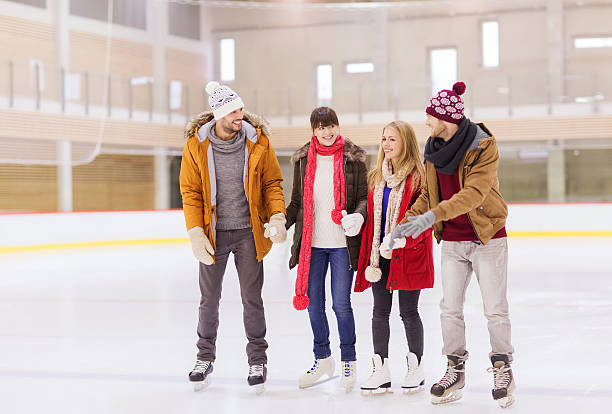 istock happy friends on skating rink 534937043