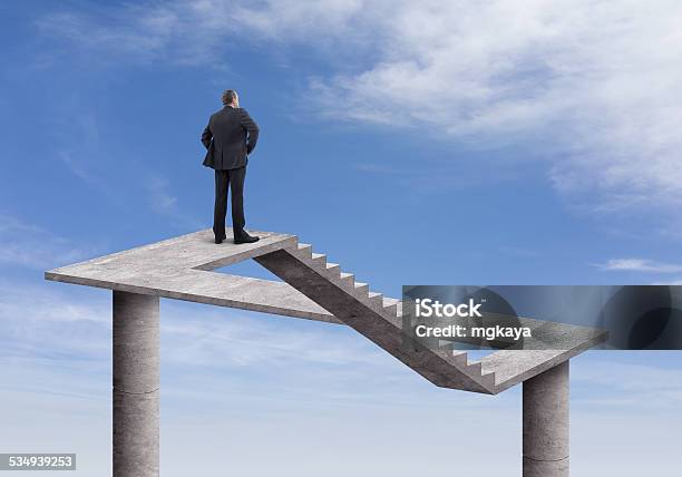 Businessman And Impossible Staircase Stock Photo - Download Image Now - Illusion, Staircase, Fantasy