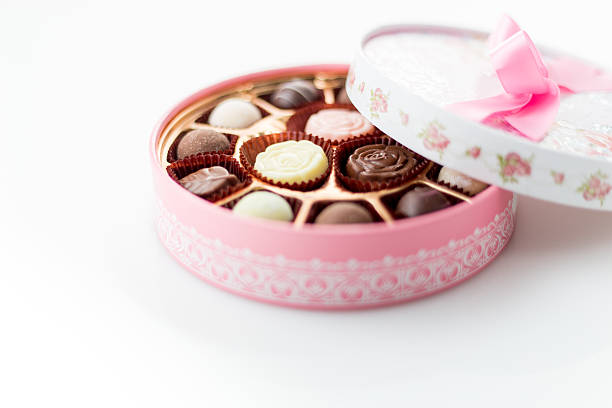 istock Chocolates in pink box on white background 534939787